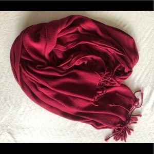 Deep red scarf with fringe detail